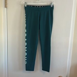 Under Armour VGUC teal color leggings , under armour down one leg